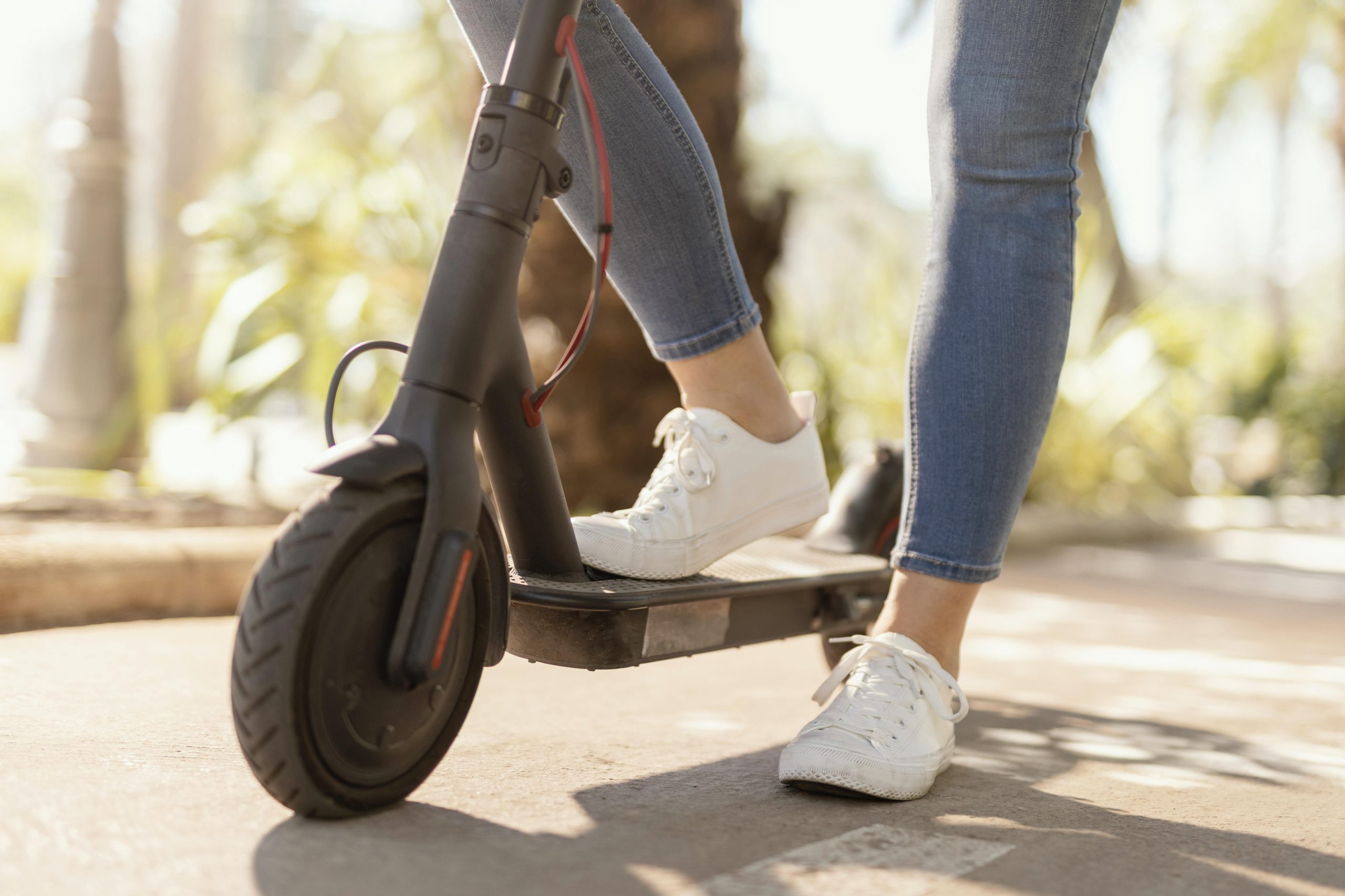 young-woman-rides-electrical-scooter-city